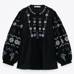 Zara black embroidered black top,  white and blue embroidered floral pattern. XS